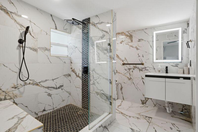 Bathroom with walk-in glass shower