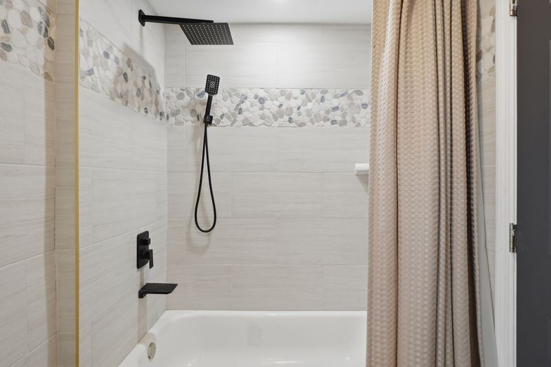 Second bathroom with tub and shower