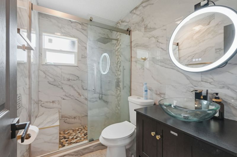 Bathroom with tiled walk-in shower