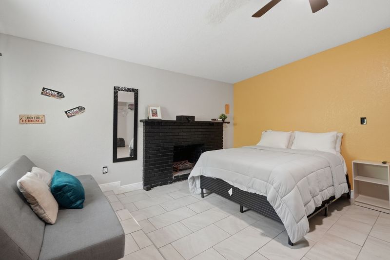 Bedroom with a queen bed and seating